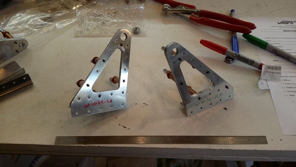 Left and right outboard aileron bearing brackets